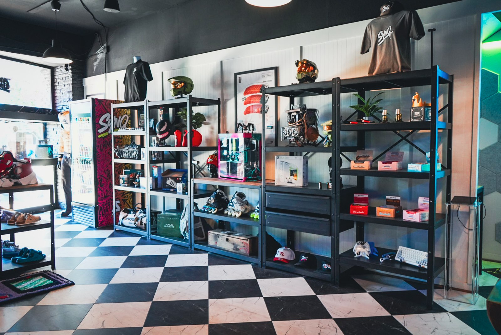 Inside SYNQ: collectibles, electronics, and a black-and-white checkered floor